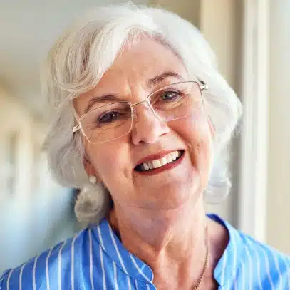 Smiling senior woman with partial dentures